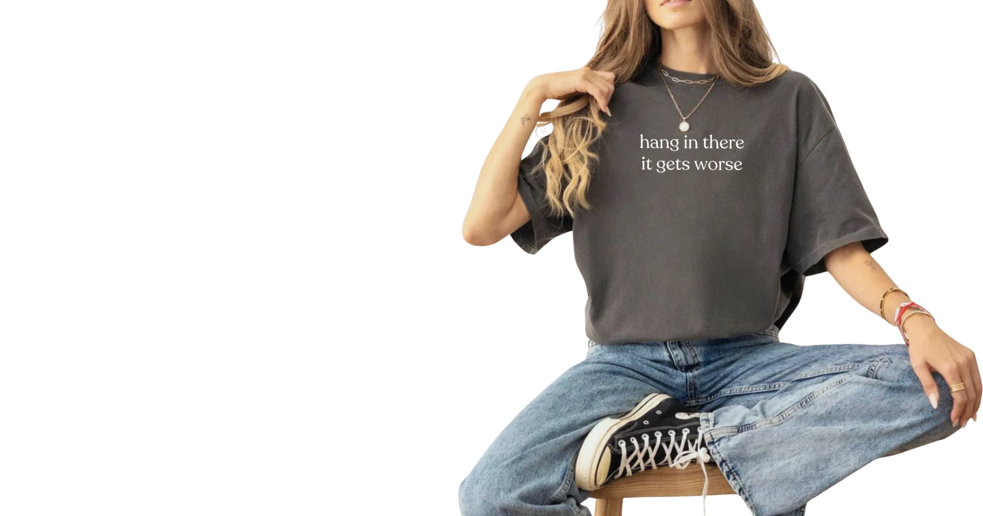 Model wearing a relaxed heavyweight tee with the text hang in there it gets worse